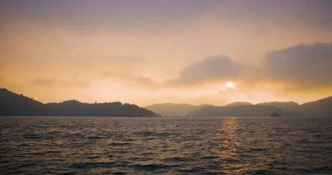Epic and beautiful sunset over the water of the Sun Moon Lake in Taiwan by boat. Stock Footage 144205586