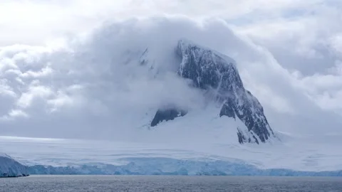 Epic Antarctica Clouds Cover Dark Mountain. Black Rock Jagged Peaks, Soft W.. Stock Footage 344463383