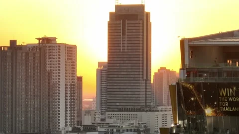 Epic Ascending view of bangkok skyline with the sun revealing Stock Footage 232466199