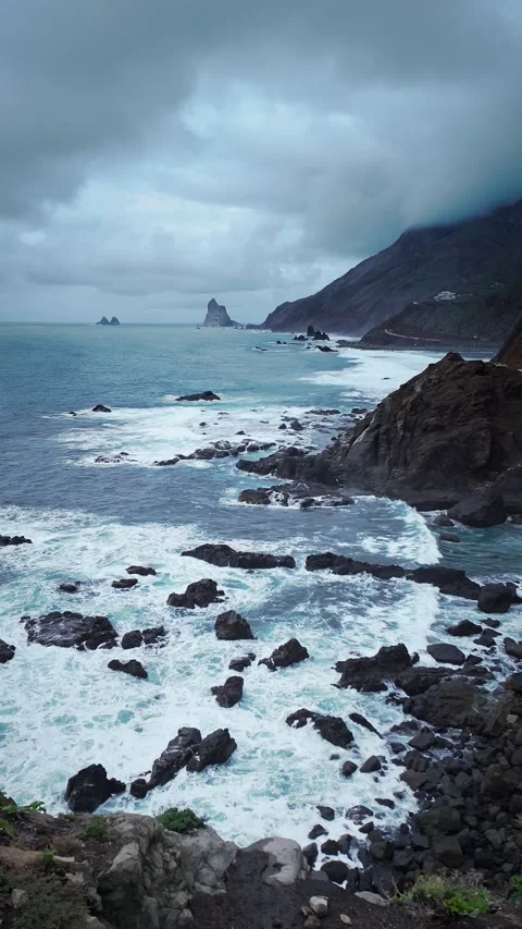 Epic background of crashing ocean waves against rugged coastal rocks. Stock Footage 294287327