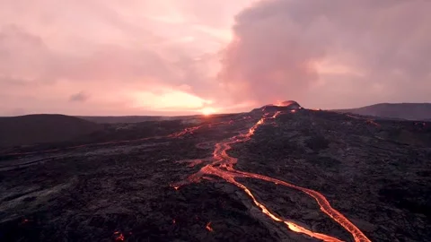 Epic Beautiful Sun Setting Erupting Volcano. Rivers of Magma Flows Stock Footage 257101407