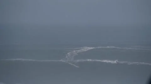 Epic boat ride over giant waves in Nazare, Portugal, showcasing extreme surfing Stock Footage 300602805