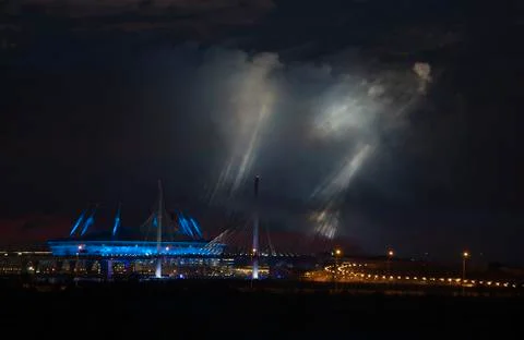 Epic buildings in smoke. Rays of multi-colored searchlights of searchlights. Stock Photos