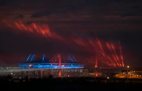 Epic buildings in smoke. Rays of multi-colored searchlights of searchlights. Stock Photos