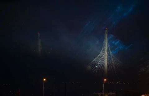 Epic buildings in smoke. Rays of multi-colored searchlights of searchlights. Fotos Stock