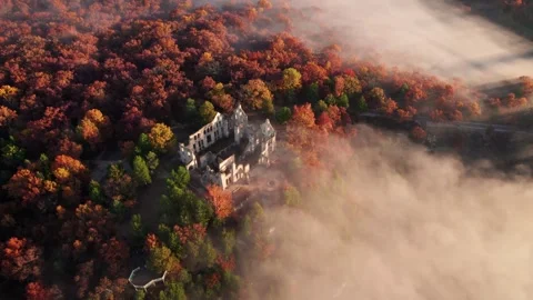 Epic Castle on Hill Drone Circles Around Cliff Edge Fantasy Fog Low Clouds Stock Footage 256172292
