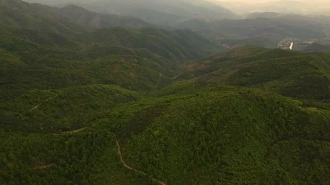 Epic cinematic aerial orbit over vast green mountain range and rolling hills Stock Footage 342240768