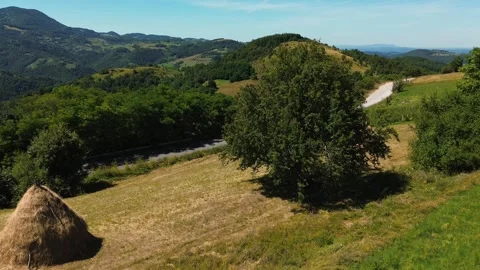Epic cinematic aerial view over green hills and country road, Serbia Stock Footage 342238261