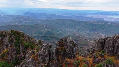 Epic Cinematic Drone Flying Through Dark Moody Mountains Towards Sea, 4K 60fps Stock Footage 335068383