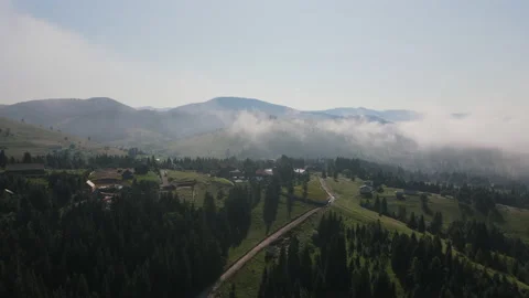 Epic cinematic drone shot clouds on sunny day, summer mountains and green forest Stock Footage 159679402