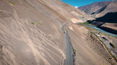 Epic Cinematic Drone View of Lone Car on Remote High-Altitude Plateau Video stock 333059722