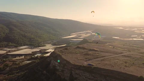 Epic Cinematic Drone View of Two Powered Paragliders Flying Over Dramatic Stock-Footage 346800532