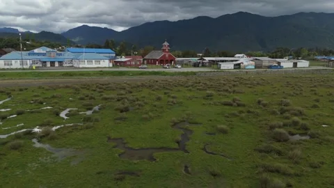 Epic Cinematic Flight Over Mirror Marshes Towards Old Red Wooden Church in Lenca Stock Footage 325335537
