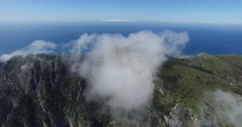 EPIC CINEMATIC REVERSE TILT SHOT OF SCENIC CLOUDS AND CAPRI LANDSCAPE Stock Footage 63313189