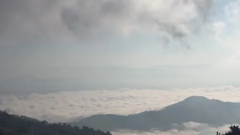 Epic Cinematic Timelapse of Rapidly Flowing Sea of Clouds Between Mountain P Video stock 328444008