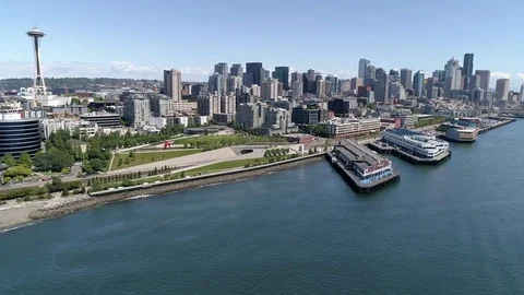 Epic Cityscape Aerial of Sunny Downtown Seattle, Washington with Scenic Water Stock Footage