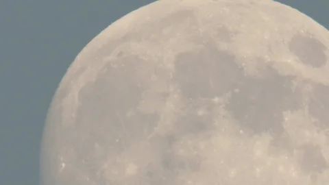 Epic close up of Orange toned Full moon moving right across night sky Stock Footage 109237936