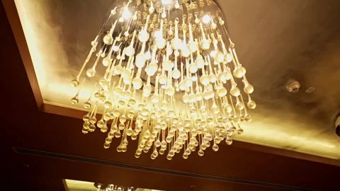 Epic close-up rotating view of a beautiful crystal chandelier hanging in a .. Stock Footage 313381667