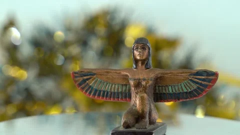 Epic close-up shot of a Cleopatra statue with wide open wings, shiny Stock Footage 259638982
