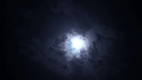 Epic clouds covering full moon in dramatic scene in the night sky Vídeo Stock 120117414