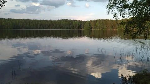 Epic clouds on the lake surface. Stock Photos