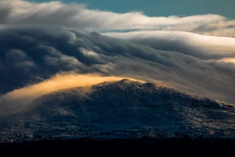 Epic clouds moving over mountains Stock Footage 123082811