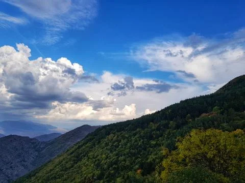 Epic clouds over the mountains Stock Photos