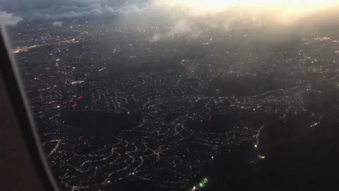 Epic clouds over a shocking modern city seen from an airplane Stock Footage 136202838