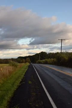 Epic Clouds at the Top of the HIl Stock Photos