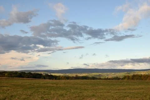 Epic Clouds at the Top of the HIl Stock Photos