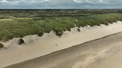 Epic coastal paragliding using onshore wind - Langevelderslag, Noordwijk; Stock-Footage 218414246