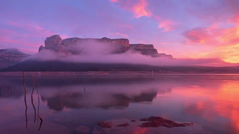 Epic Colorful Sunrise in a beautiful lake with rocky mountains. Stock Footage