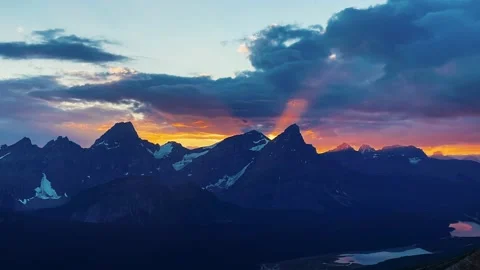Epic Colorful Sunset Over Vast Rocky Mountain Range Stock Footage 230093268
