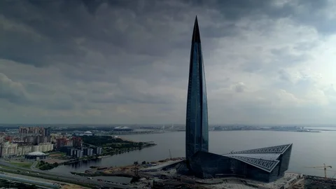 Epic dark clouds highest skyscraper Petersburg Russia dramatic cityscape Aerial  Video stock 128621013