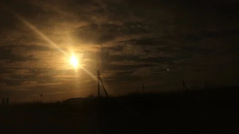 Epic dark sunset view from train window Stockbeeldmateriaal 124730821
