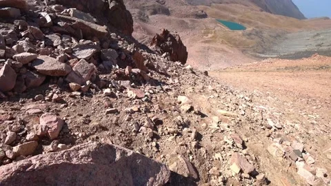 Epic descent over rocks in the mountains 動画素材 212996933