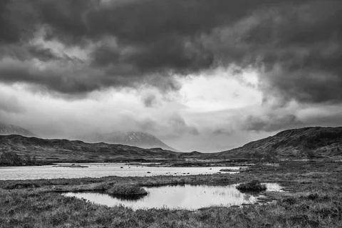 Epic dramatic  black and white landscape image of Loch Ba on Rannoch Moor in  Stock Photos