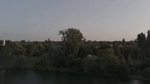 Epic Drone Approach Over Lake Revealing Historic Cathedral at Golden Hour Видео 327560107