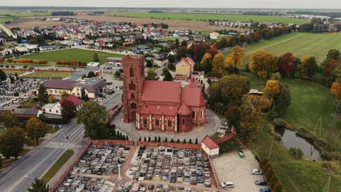 Epic drone circle of the historic, brick Church of St. Jadwiga in Pępowo Stock Footage 319703243