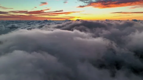Epic drone flight over clouds before sunrise. Flying above the clouds Stock Footage 169694426