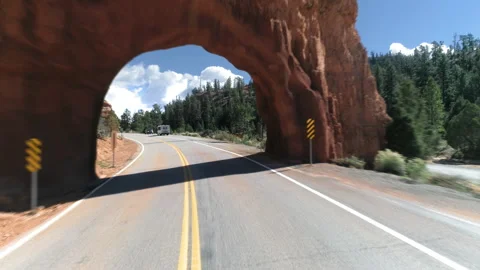 Epic drone flight through the natural arch in the red rock at Bryce Canyon. 4K Stock Footage 134566837