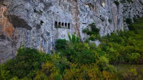 Epic Drone Flight Toward Ancient Tomb Above a Cliff Stock Footage 336903317