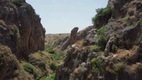 Epic drone footage flying through a massive and rocky desert canyon. Stock Footage 154753052
