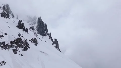 Epic drone footage of a towering snowy mountain Stock Footage 310883053