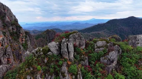 Epic Drone Peak Reveal Over Massive Autumn Forest and Giant Hills, 4K 60fps Stock Footage 335080205