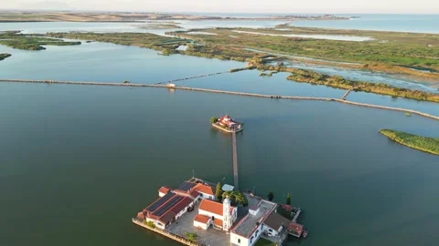 Epic Drone Pullback Reveal of Porto Lagos Lagoon and Twin Monasteries at Gol Stock Footage 340258879