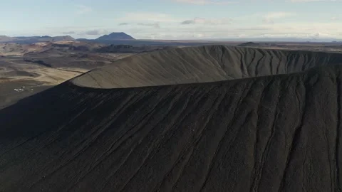 Epic drone shot of black ash volcano tephra cone during sunlight in Stock Footage 226945118