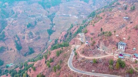 Epic Drone Shot of a Car Driving through a Curvy Mountain Road Stock Footage 331442607