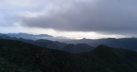 Epic drone shot of cloud covered mountains in angeles national forest Stock Footage 86918177