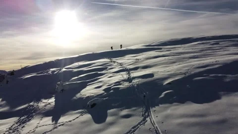 Epic drone shot of two ski tourers on snow covered mountain ridge Stock-Footage 145800187